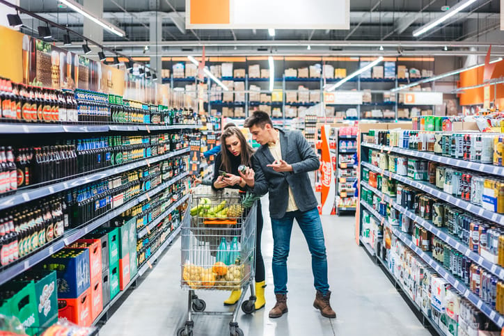 Couple grocery shopping together.