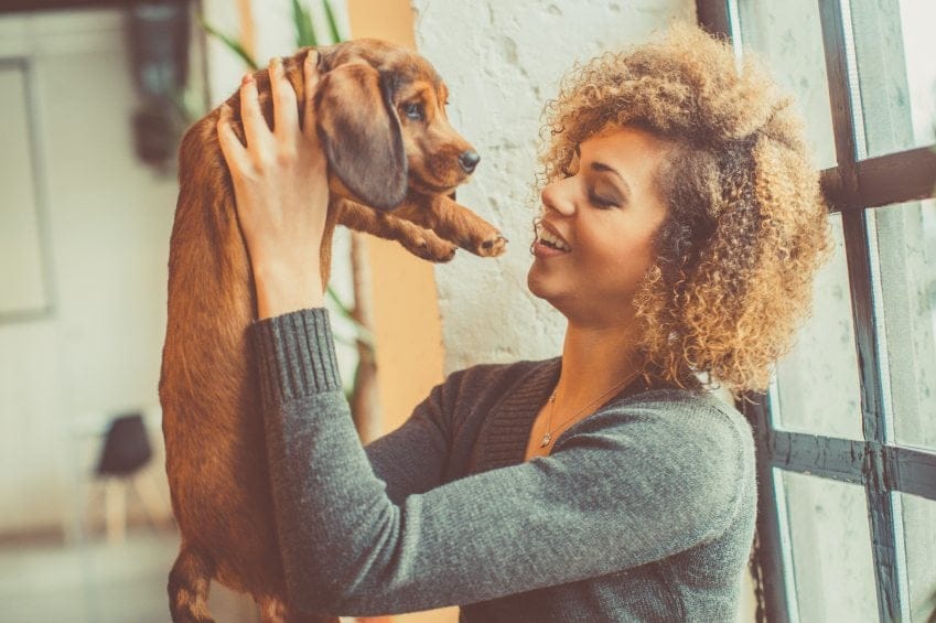 Biracial girl with puppy