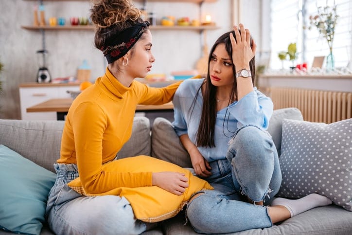 female friends having serious conversation