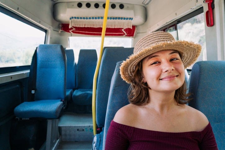 smiling woman on bus