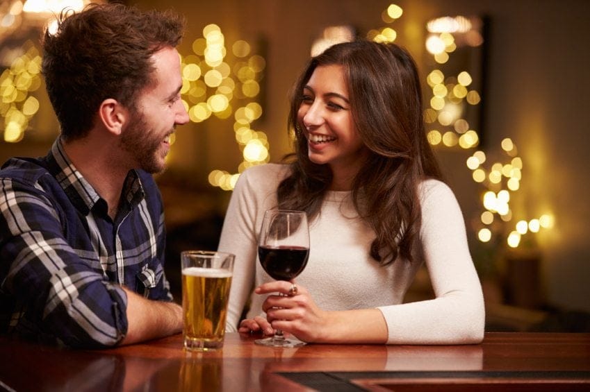 Couple having a drink at bar