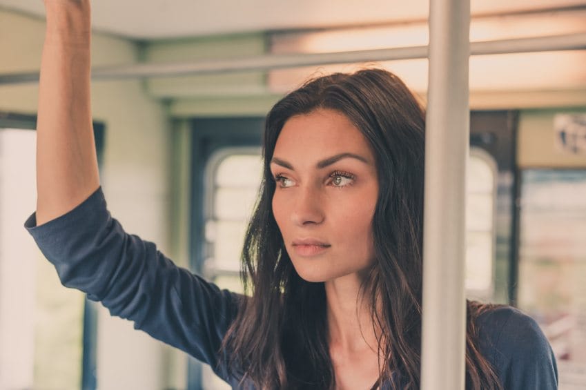 woman on train looking upset