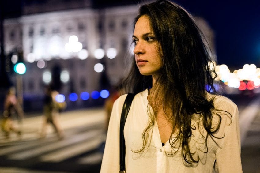 Woman walking alone at night