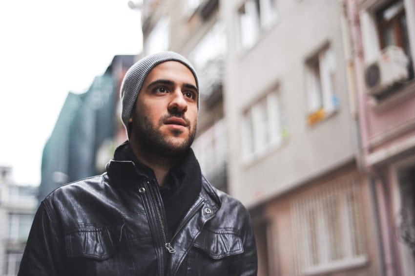 Bearded guy in leather jacket walking