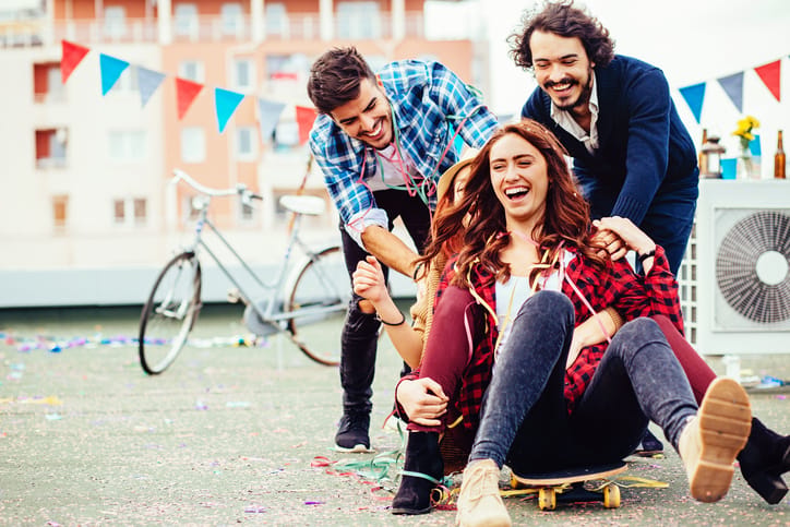 Happy people having a party on a roof.