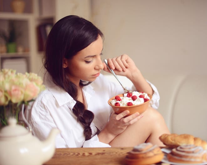 young woman having breakfast