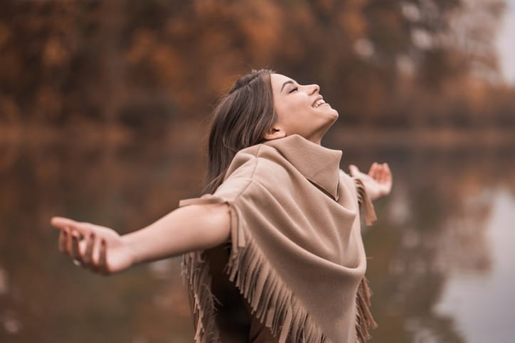 Carefree woman on the river