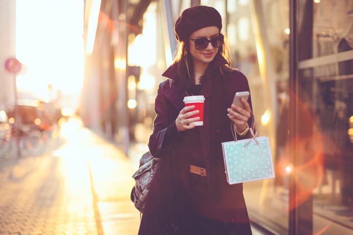 woman texting in the street