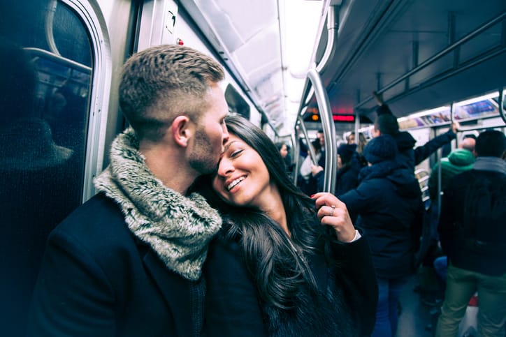 loving couple on the subway train