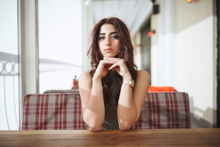Portrait of young woman in a cafeteria.