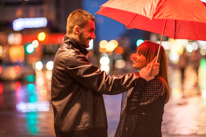Young couple in the rain
