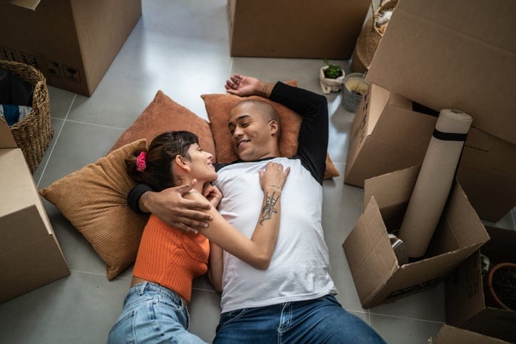 compatible couple cuddling on floor