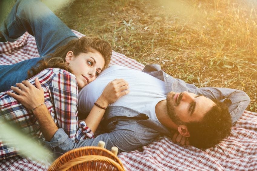 Couple laid having picnic