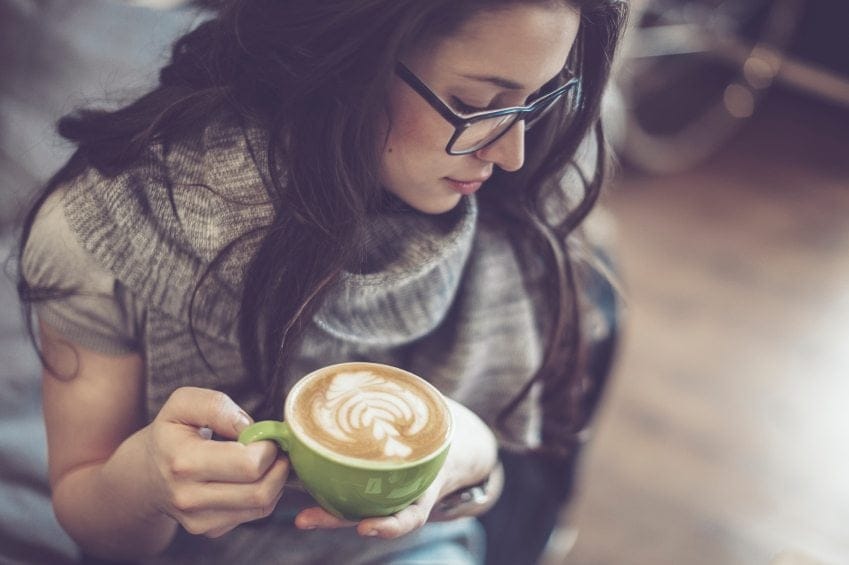 woman with glasses and coffee