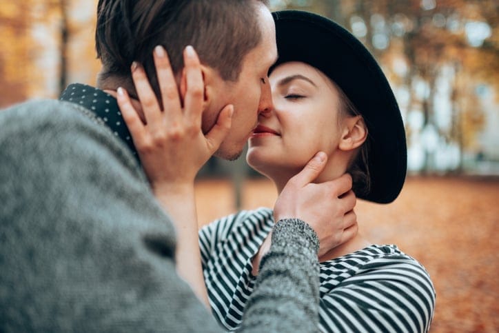 couple kissing outdoors