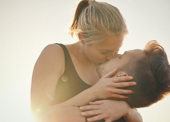 Shot of a young couple kissing outdoors