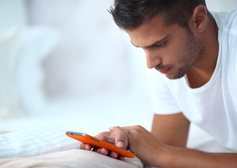 Guy texting on phone