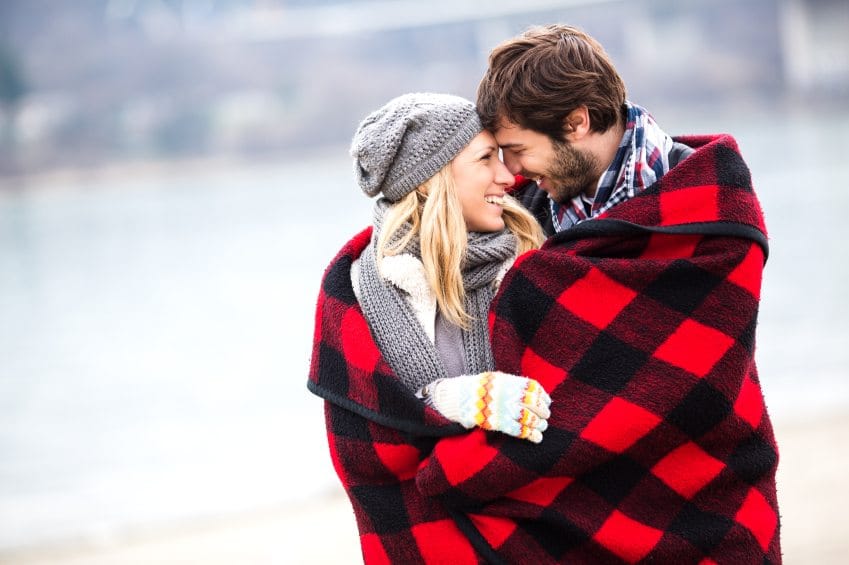 Couple wrapped in blanket