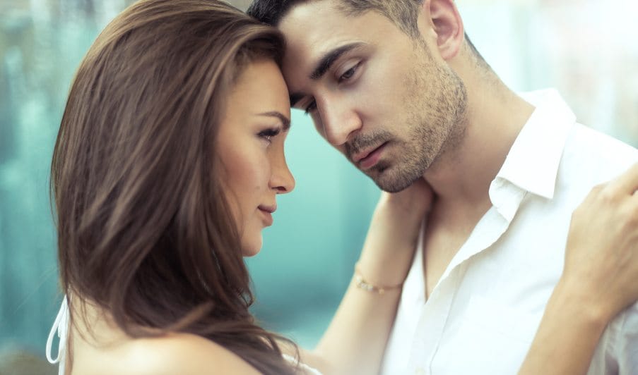 Young attractive couple holding each other