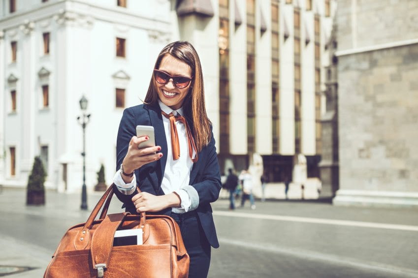Woman in suit with handbag
