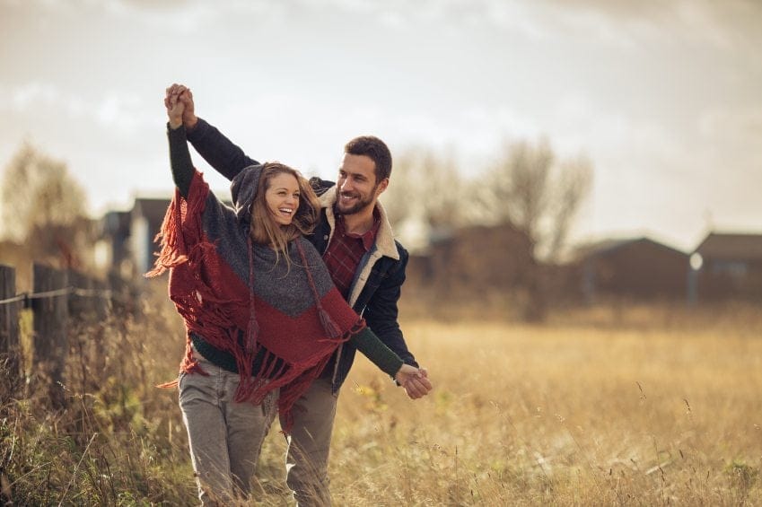 Couple having fun in a field