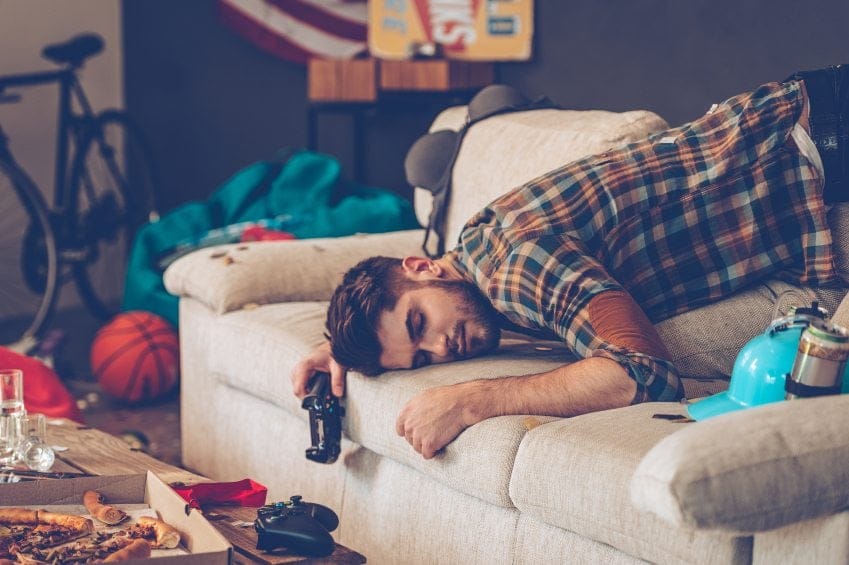 Guy laid out on sofa