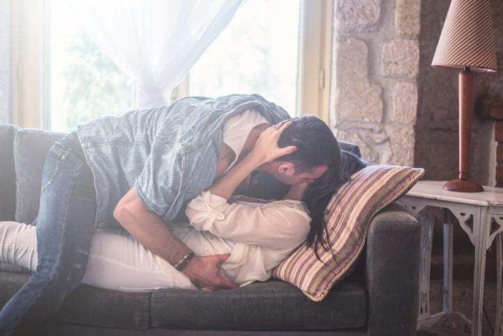 Love Couple have intimate moments at the sofa bed.