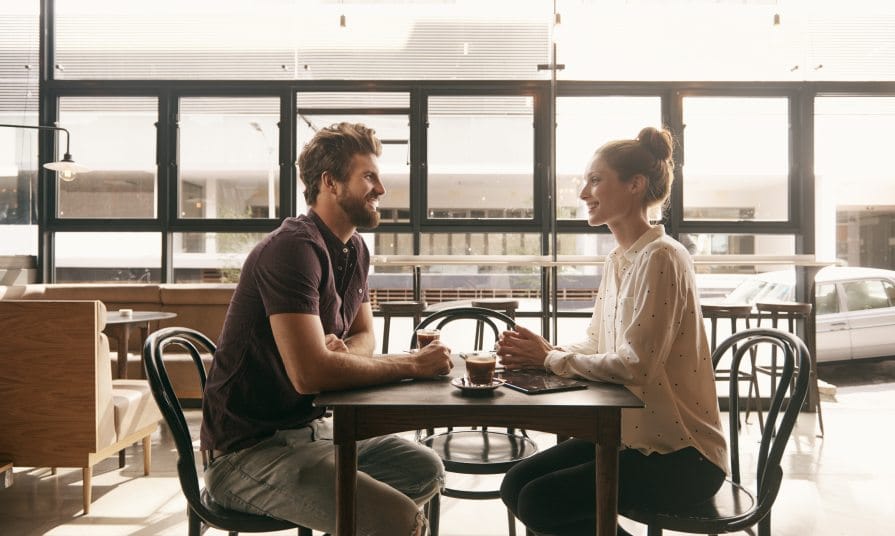 Young hipster couple having coffee