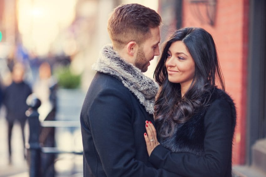 Embracing couple outdoors