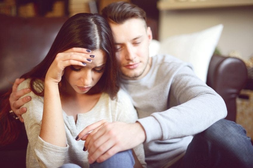 Girl being consoled by boyfriend