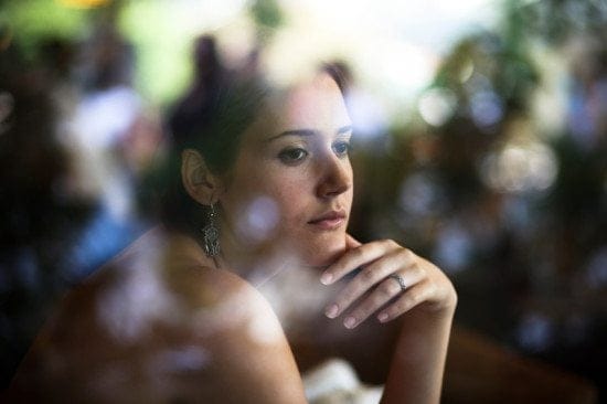 serious woman portrait through window