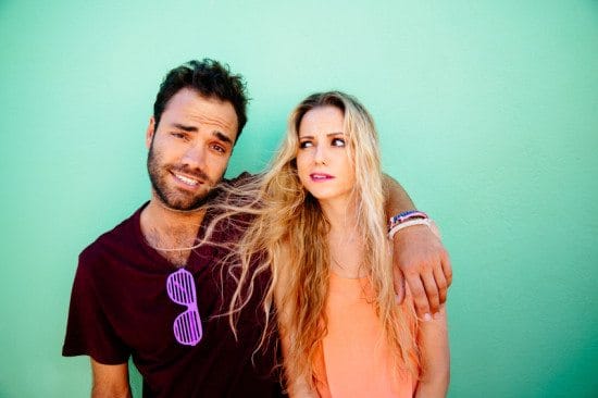couple making funny faces green background