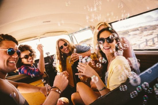 friends blowing bubbles on roadtrip