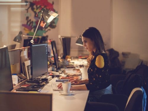 office worker staying late at computer