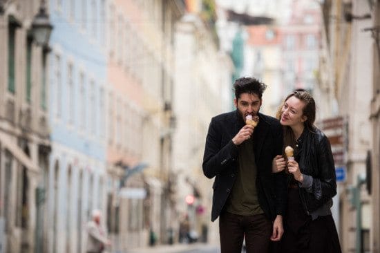 couple eating ice cream on city street