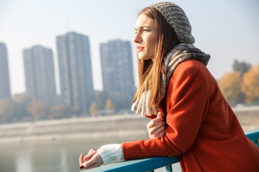 Young long haired girl on bridge