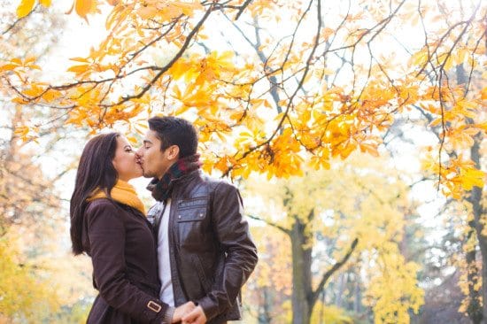 couple kissing in autumn park