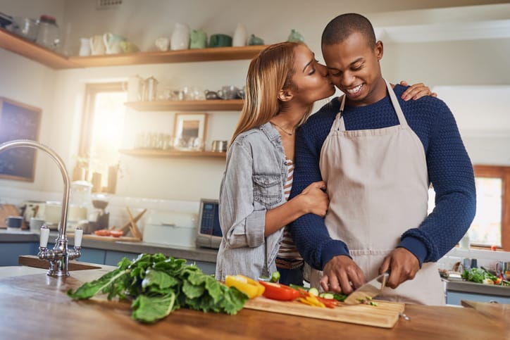 Couple cooking together.