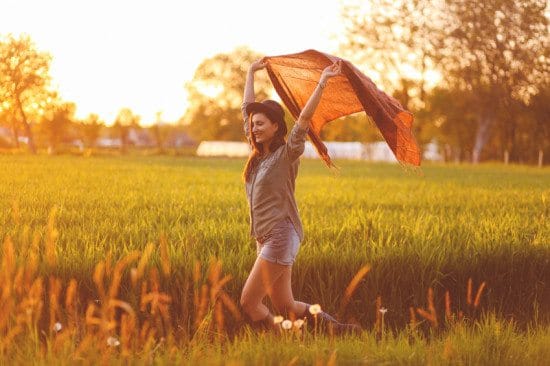 woman in field on summer day