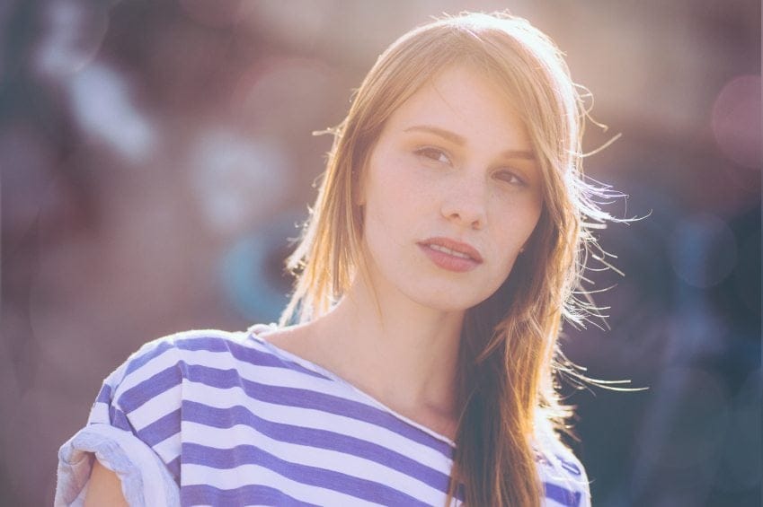 woman in striped shirt on sunny day
