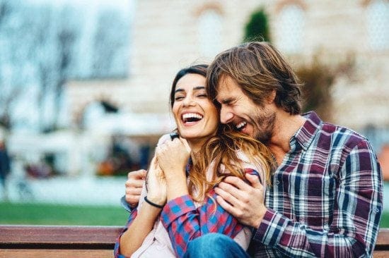 laughing couple in park
