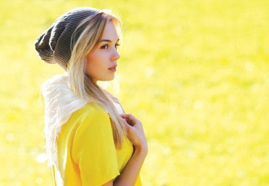woman in yellow t-shirt outside