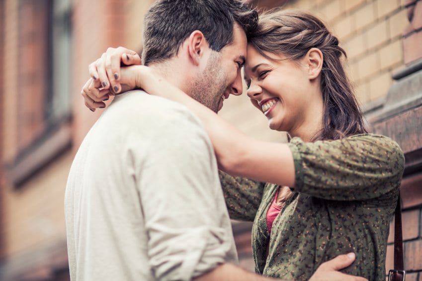 happy couple laughing embracing