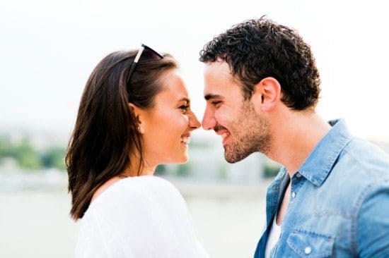 couple touching noses and smiling