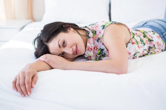 woman in floral shirt in bed