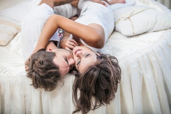 couple cuddling in bed