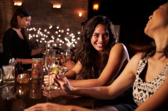 2 female friends enjoying dinner out
