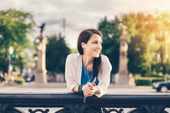 woman in headphones in park