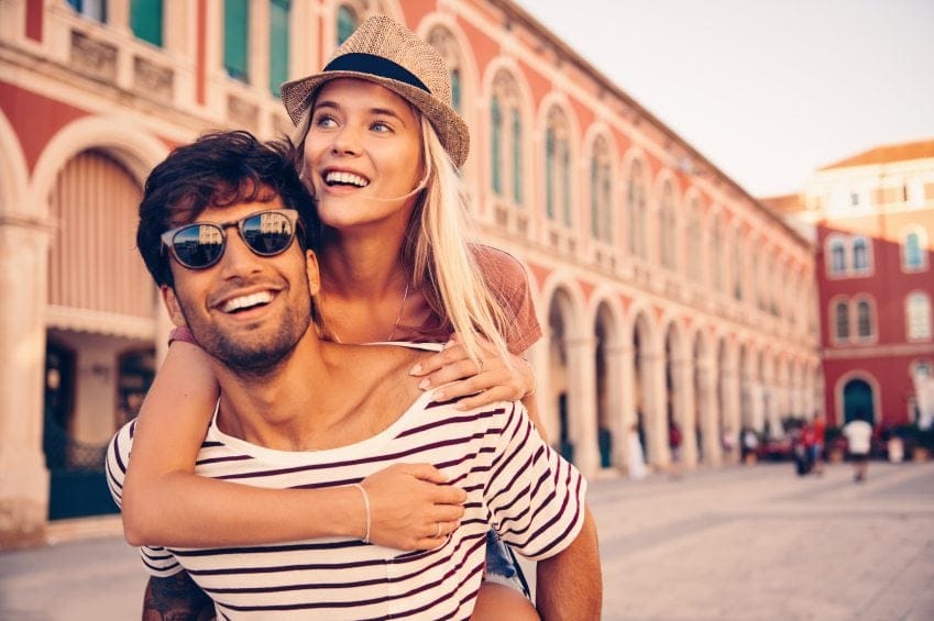 embracing couple on city break