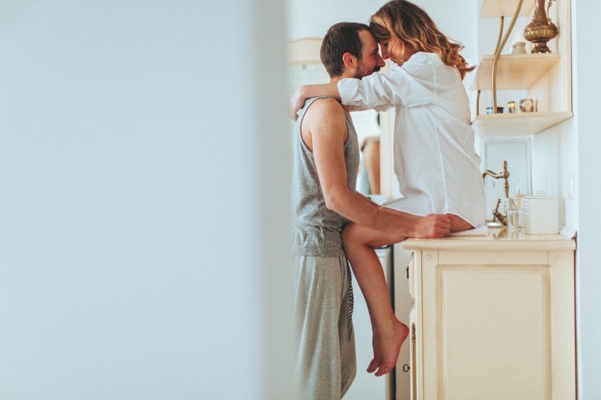 couple kissing kitchen sexy